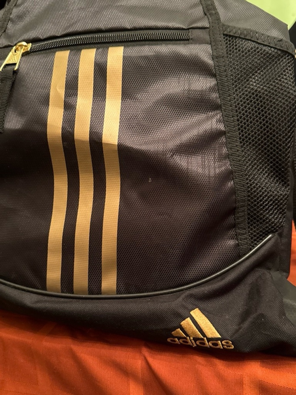 adidas Black Backpack with Gold Stripe Accents